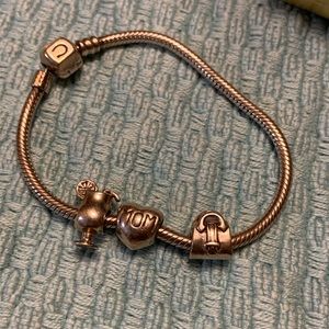 Beautiful 925 Camilla bracelet with three charms.